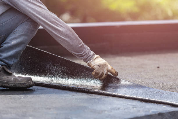 Professional Basement Waterproofing technician working in Lakewood, NY